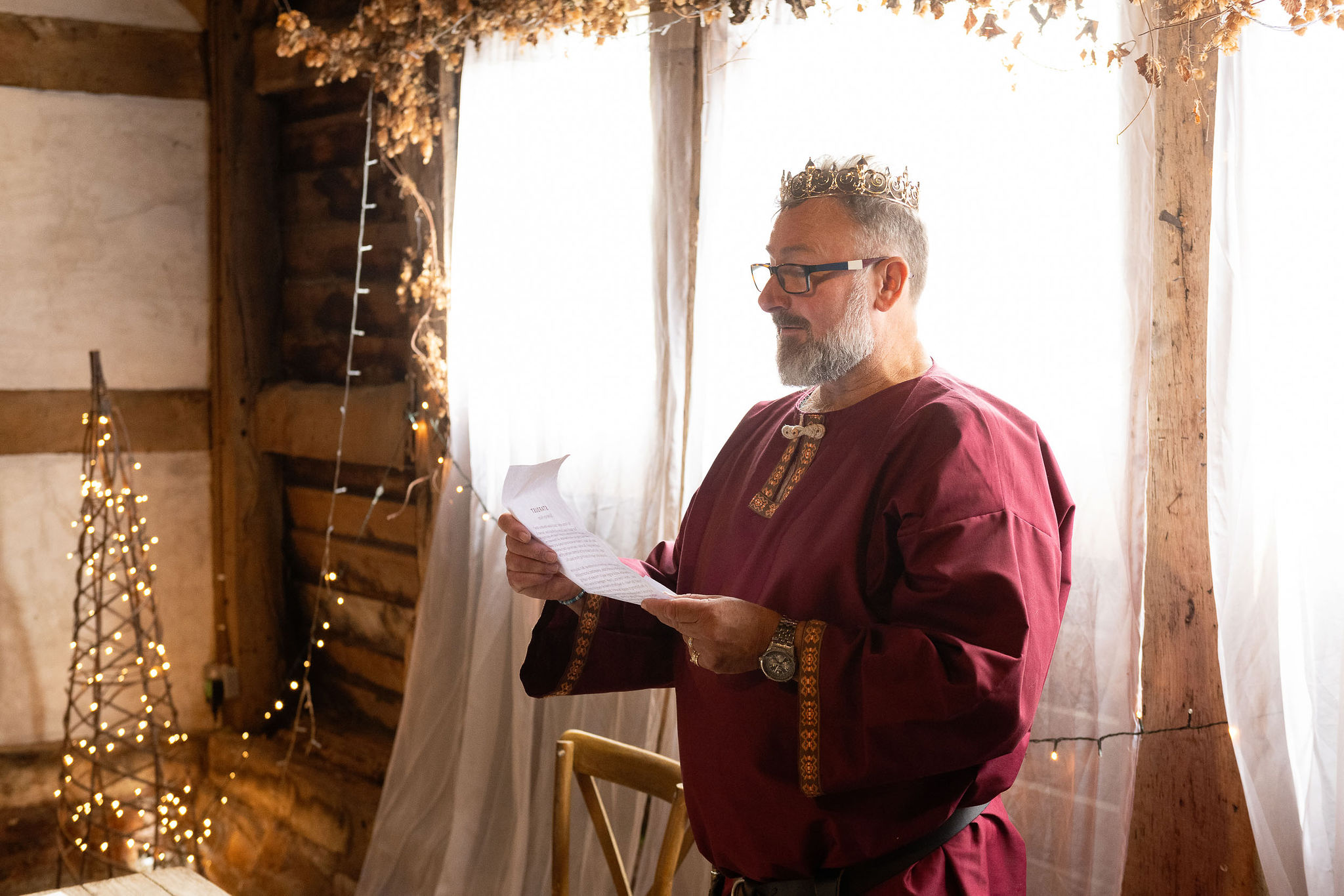wedding celebrant wearing medieval costume and crown - fantasy wedding theme