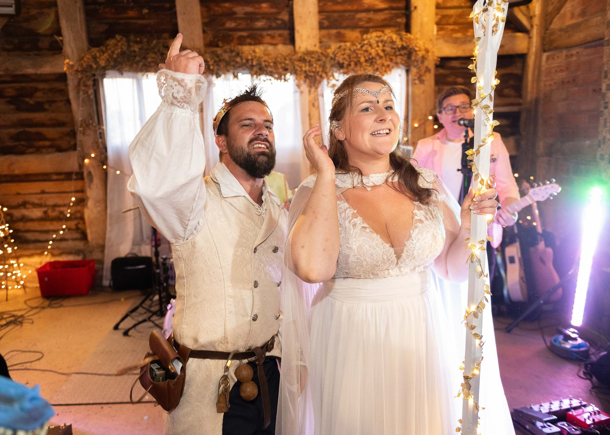 bride and groom with a medieval wedding theme dancing to music
