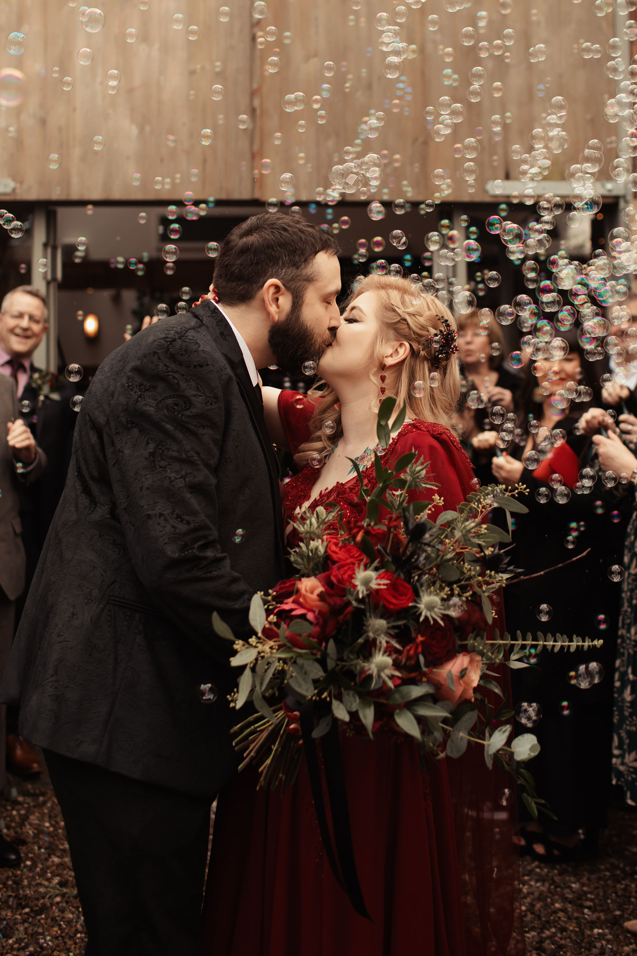 bride and groom kissing surrounded by bubbles - fun alternative to confetti photo