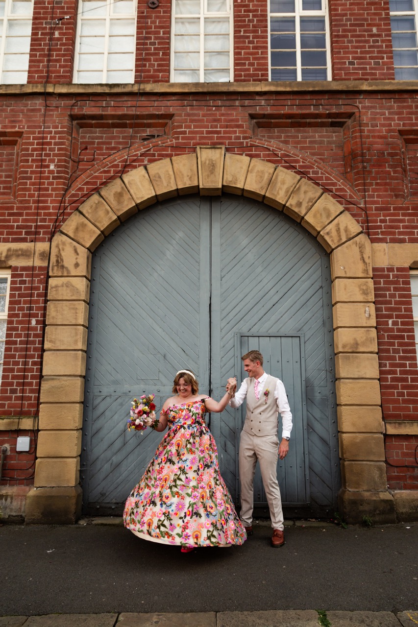 bride and groom dancing outside their industrial wedding venue in sheffield