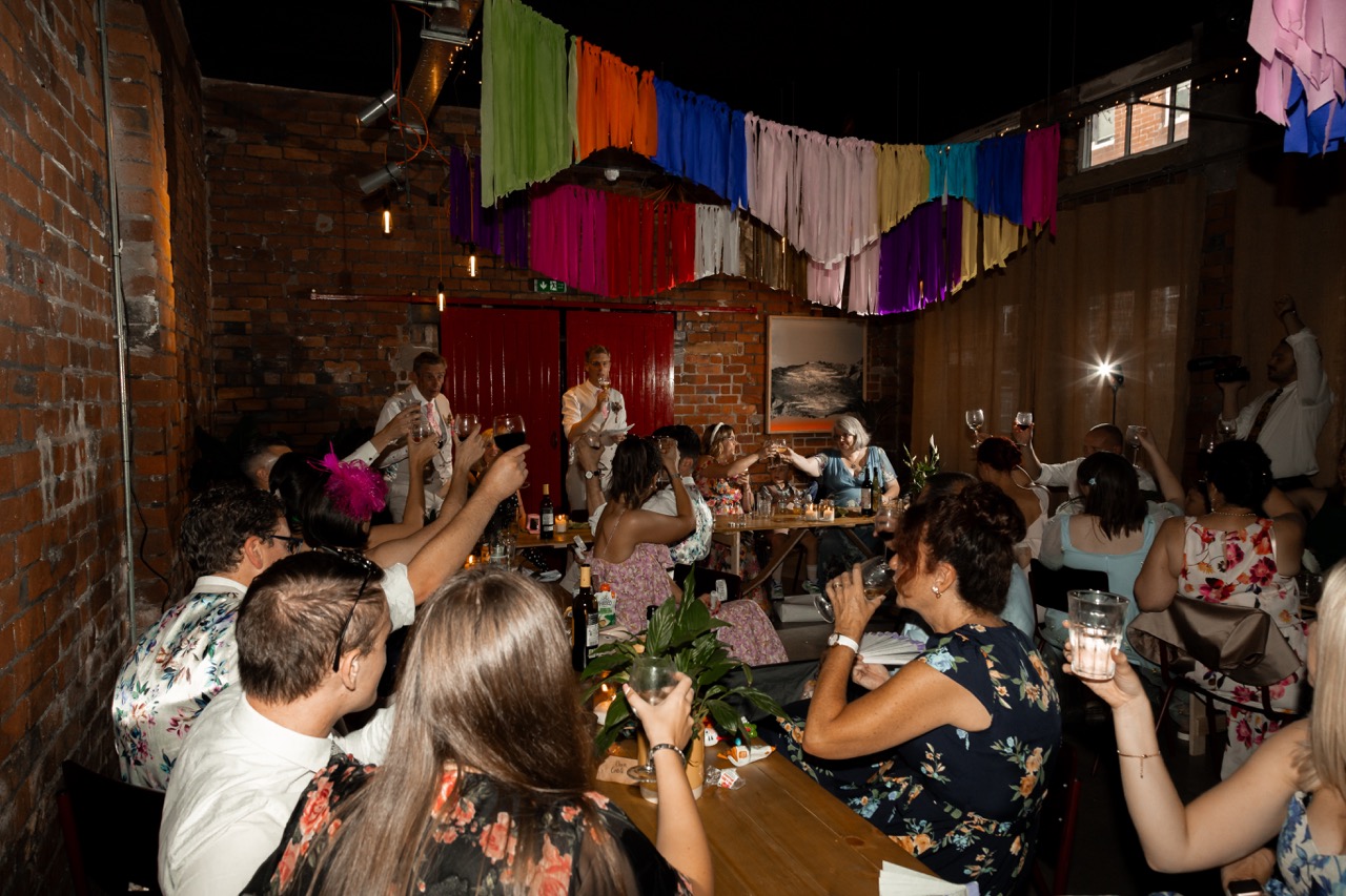industrial wedding venue in sheffield decorated with rainbow tassels