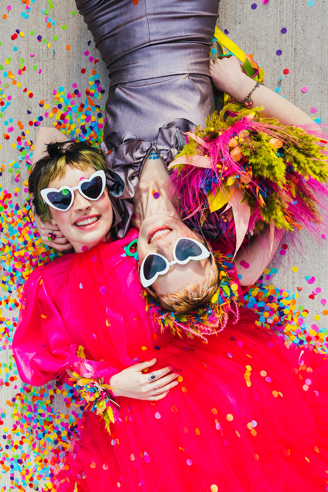 fun confetti photo with colourful and unique wedding wear