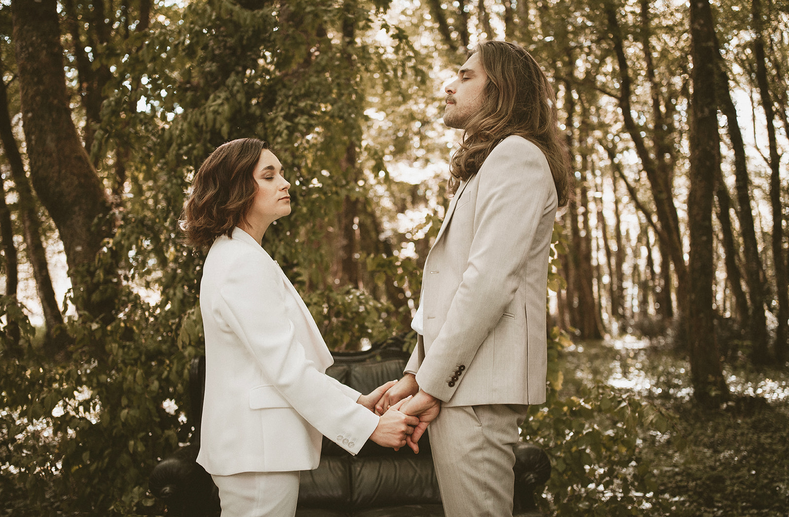 bride and groom holding hands in the woodlands for intimate wedding ceremony