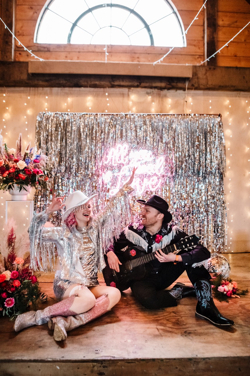fun western wedding theme with silver tassels and colourful wedding flowers