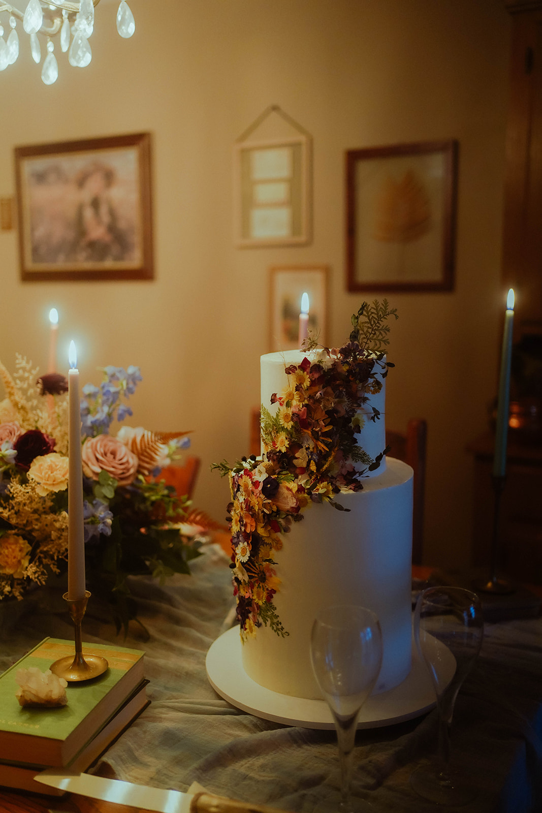two tier white wedding cake decorated with flowers