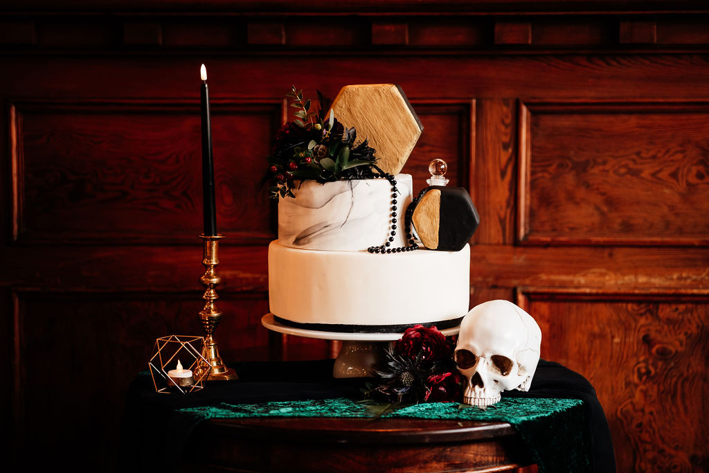 two tier black and white wedding cake with geometric details