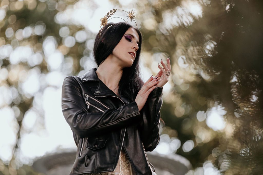 bride wearing leather jacket and celestial headpiece