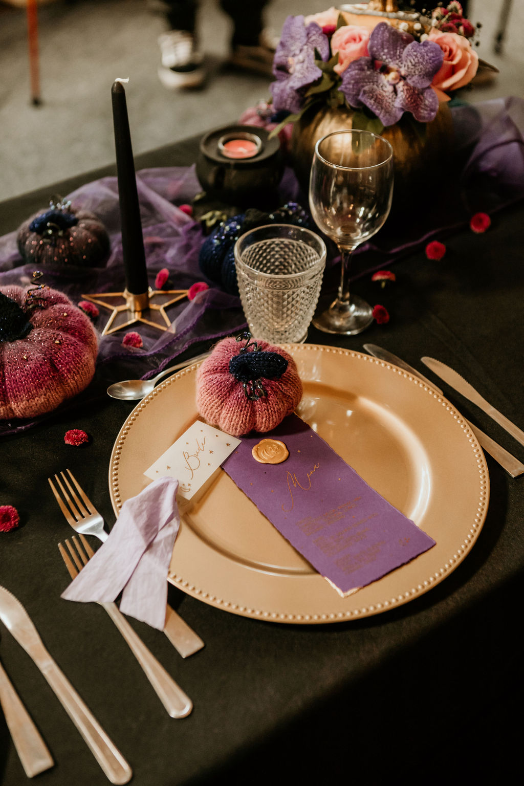 purple wedding table with knitted pumpkin favours