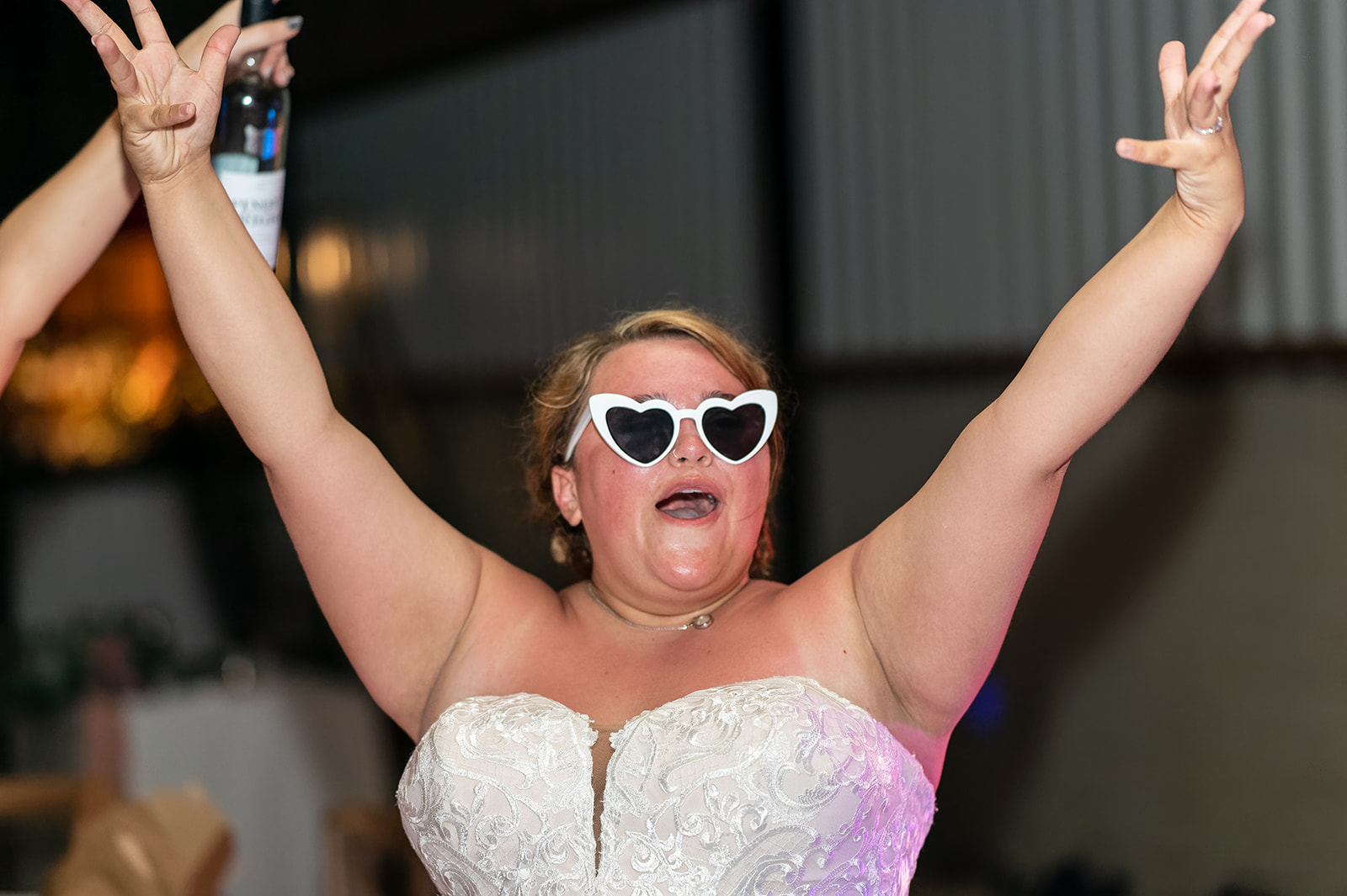 rustic wedding at The Tractor Barn at Stone Sidings wedding venue in Northamptonshire. Bride wears bridal sunglasses