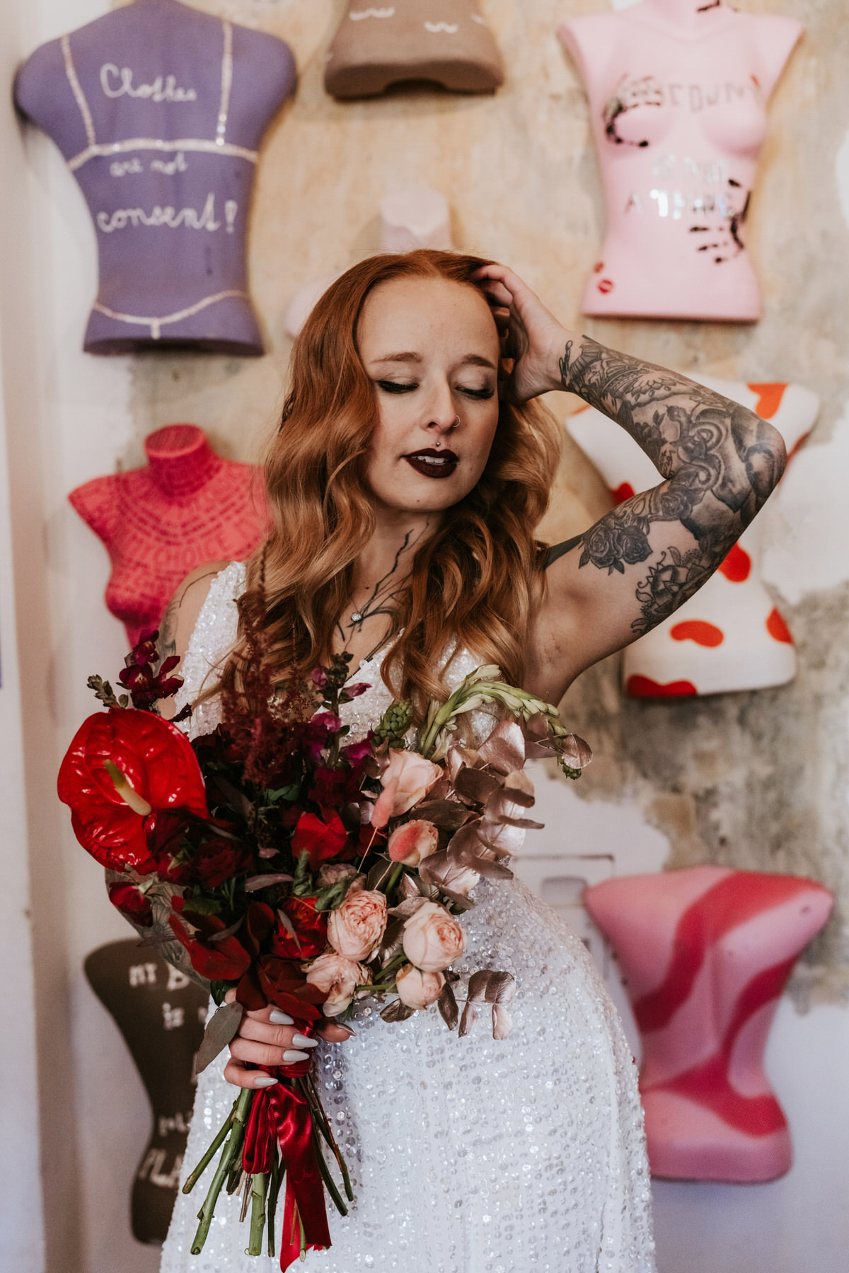 alternative bride holds a dried flower bridal bouquet.