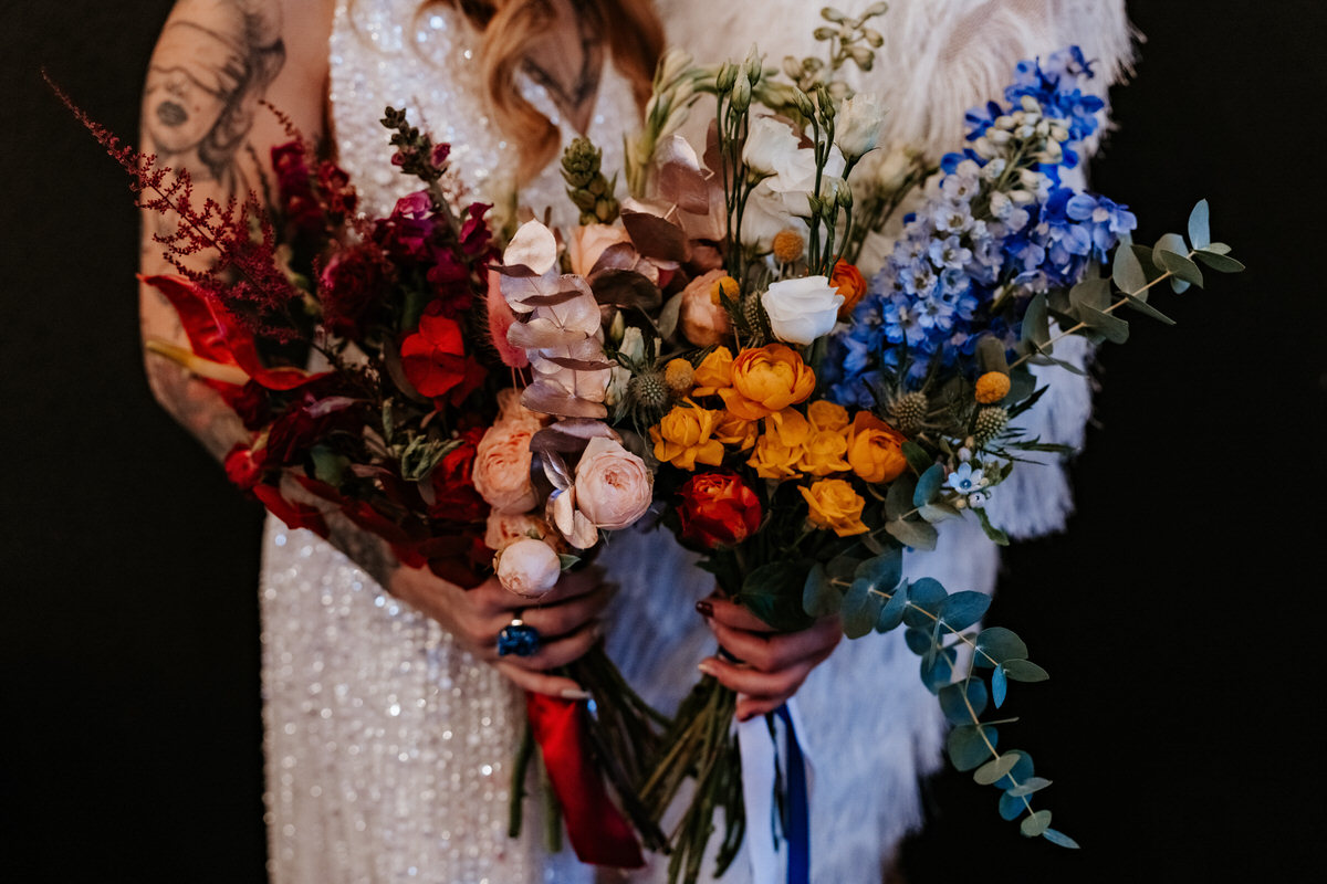 orange, blue and white flower bridal bouquet