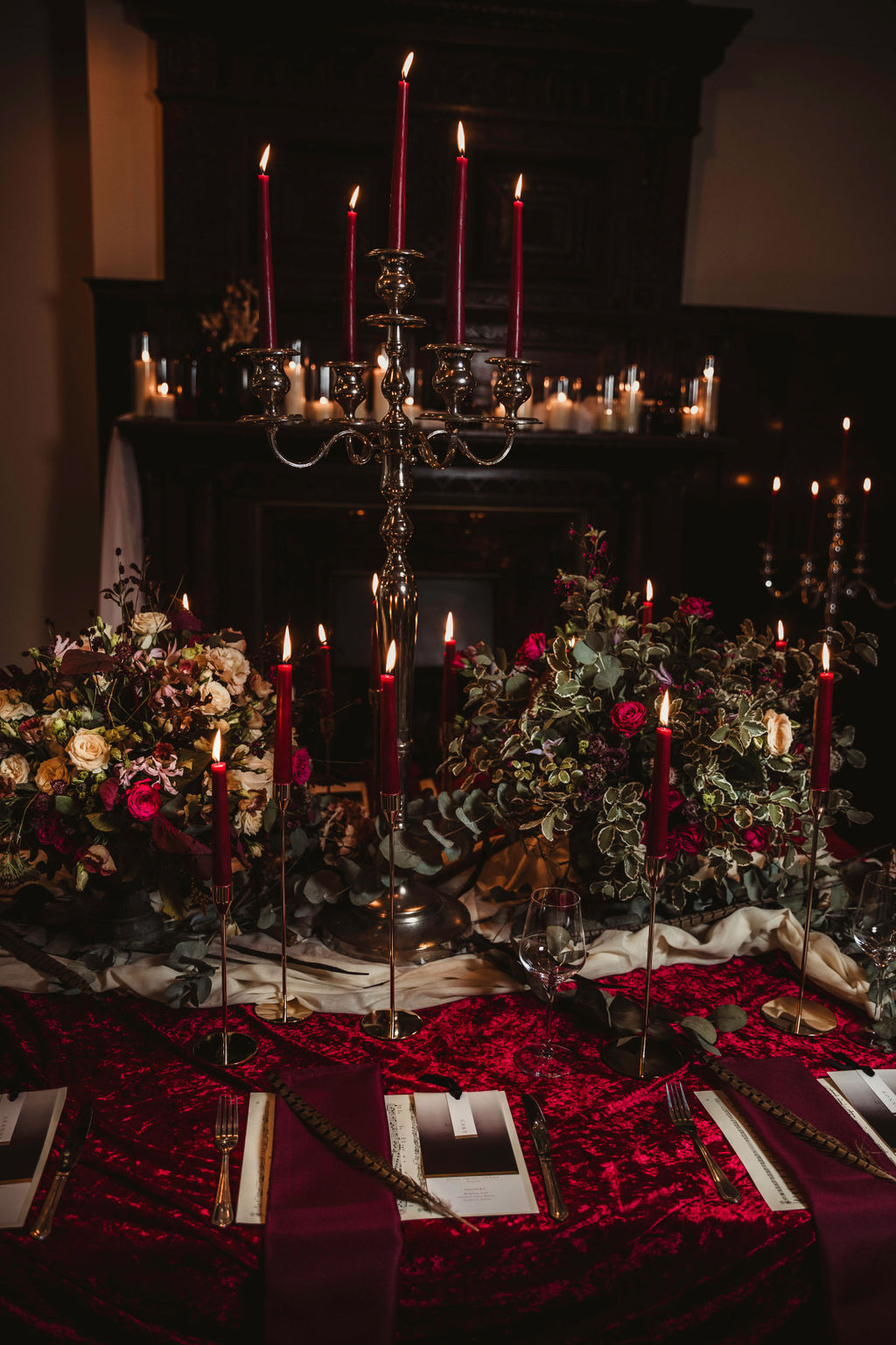 winter gothic wedding table with velvet table cloth and red candles