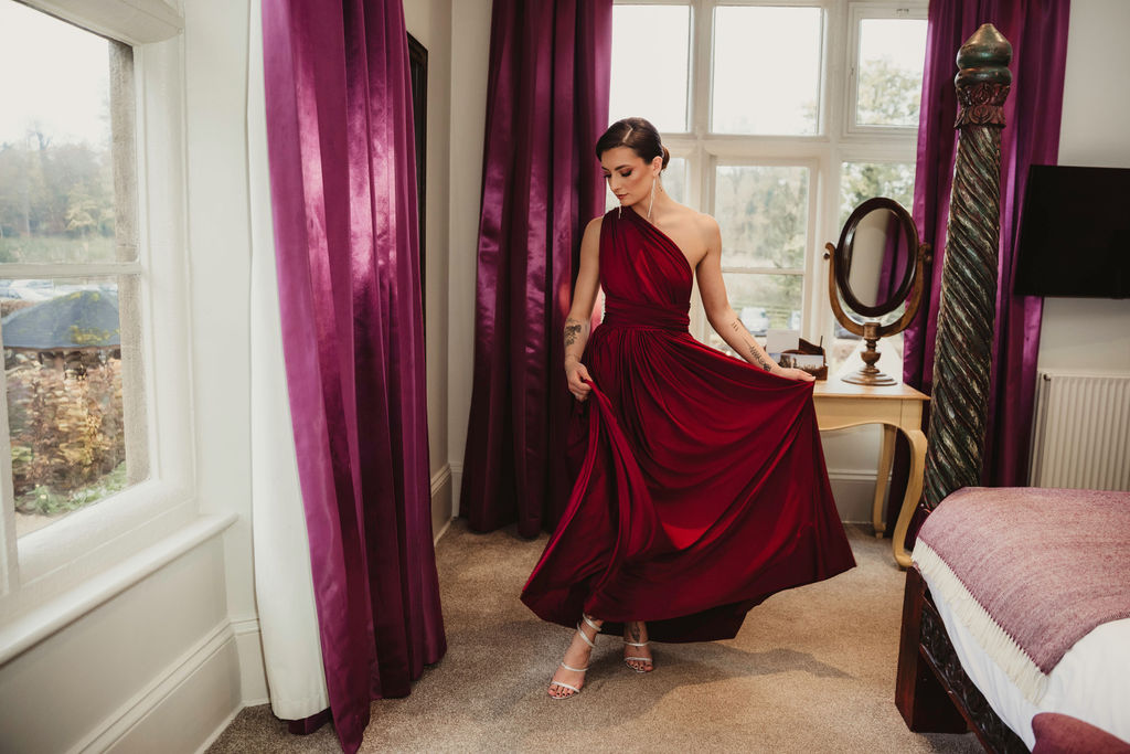 red wedding dress with off the shoulder draping design, alternative wedding dress