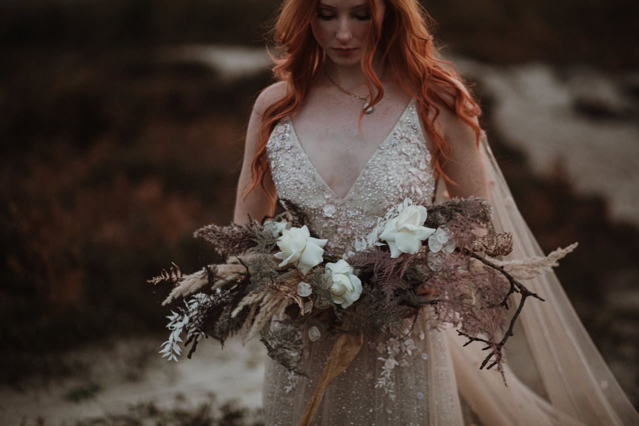 unique bridal bouquet with dried flowers, twigs and white roses