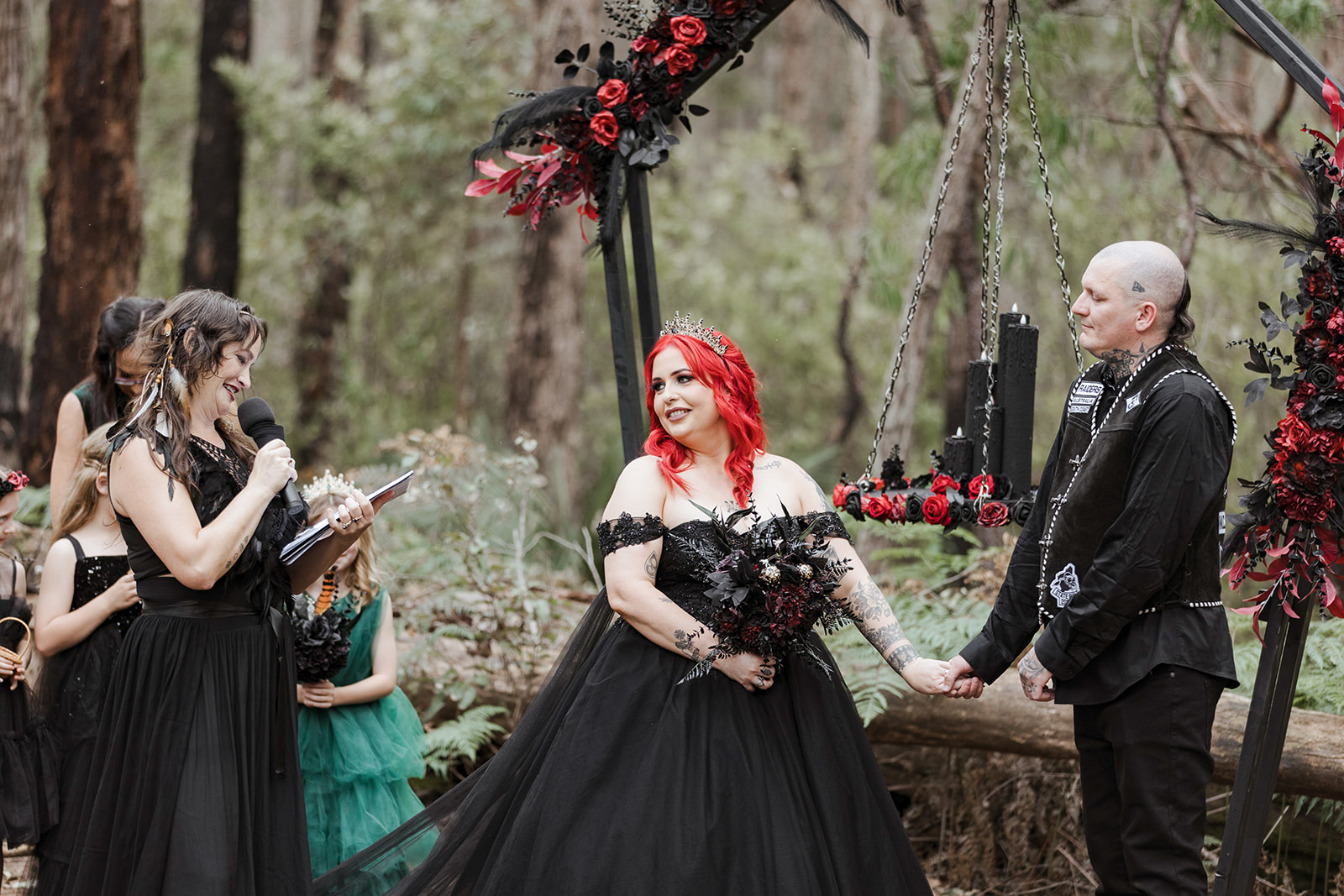 gothic pagan wedding ceremony in front of coffin shaped arch