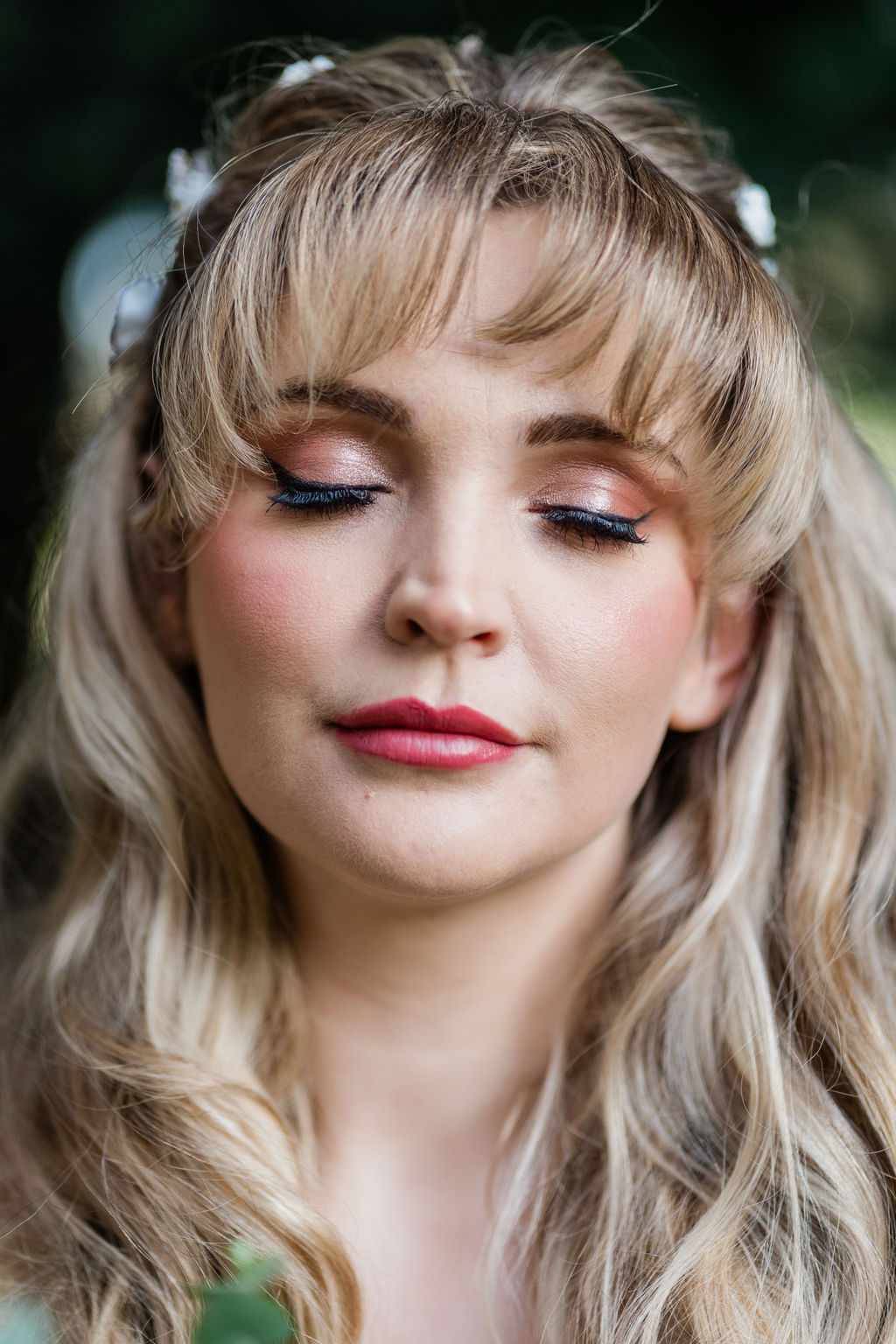 rosy bridal makeup with heavy blush and pink lipstick