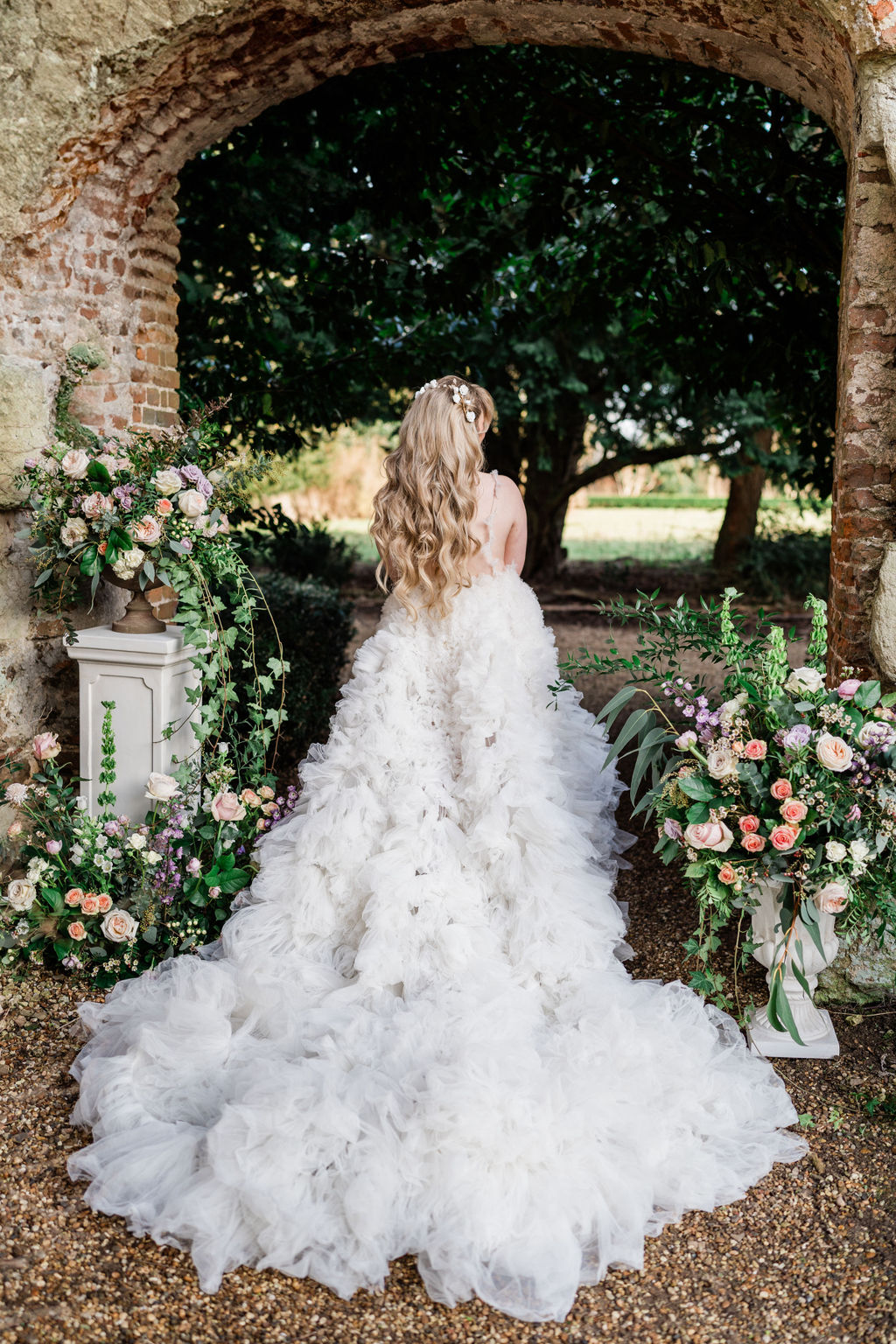 wedding dress with long tulle train for pastel fairytale wedding