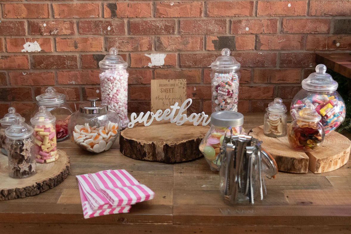 A selection of sweets in jars for evening wedding guest to enjoy