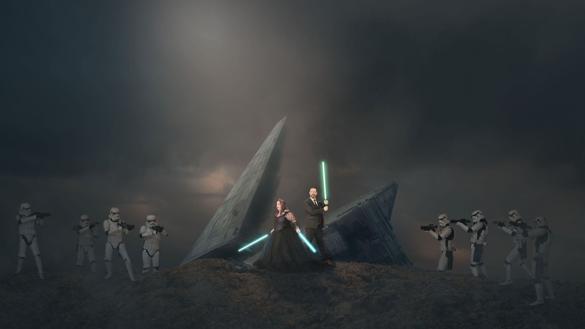 A couple's wedding portrait edited to look as if they are holding lightsabers fighting off storm troupers