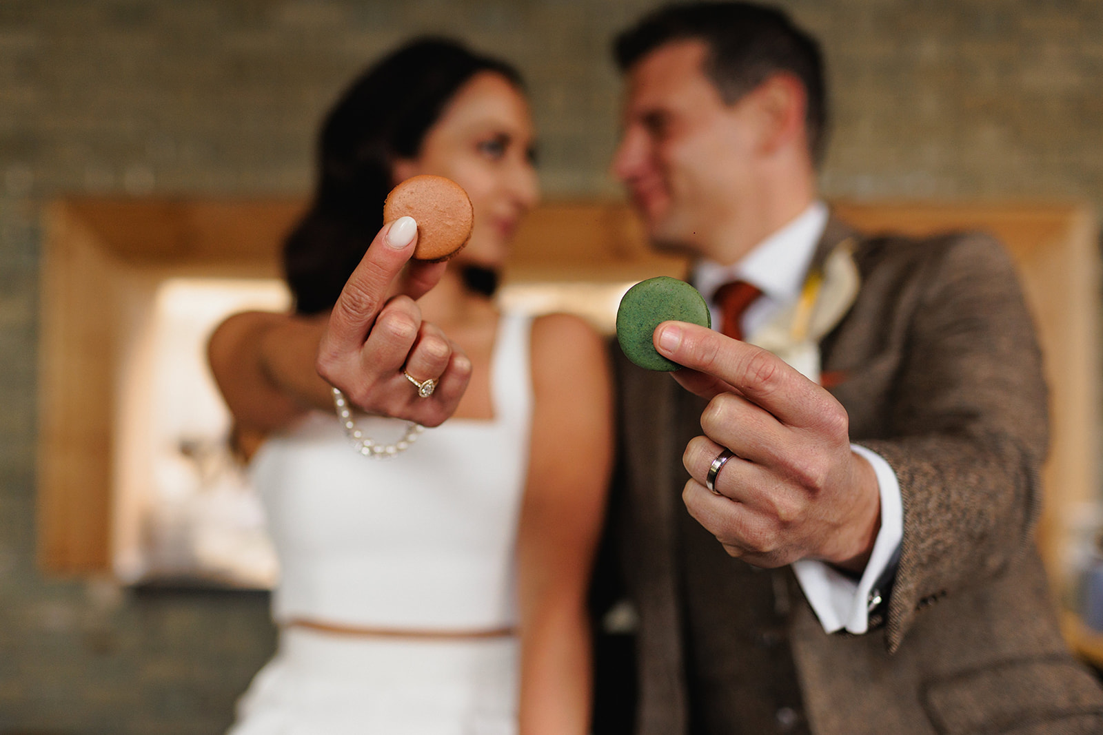 close up of wedding macaroons and grooms wedding ring