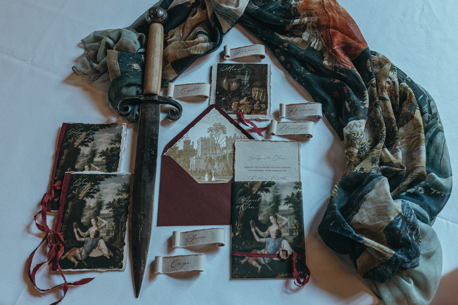 a collection of gothic old world stationery, featuring an envelope with castle engraving inside.