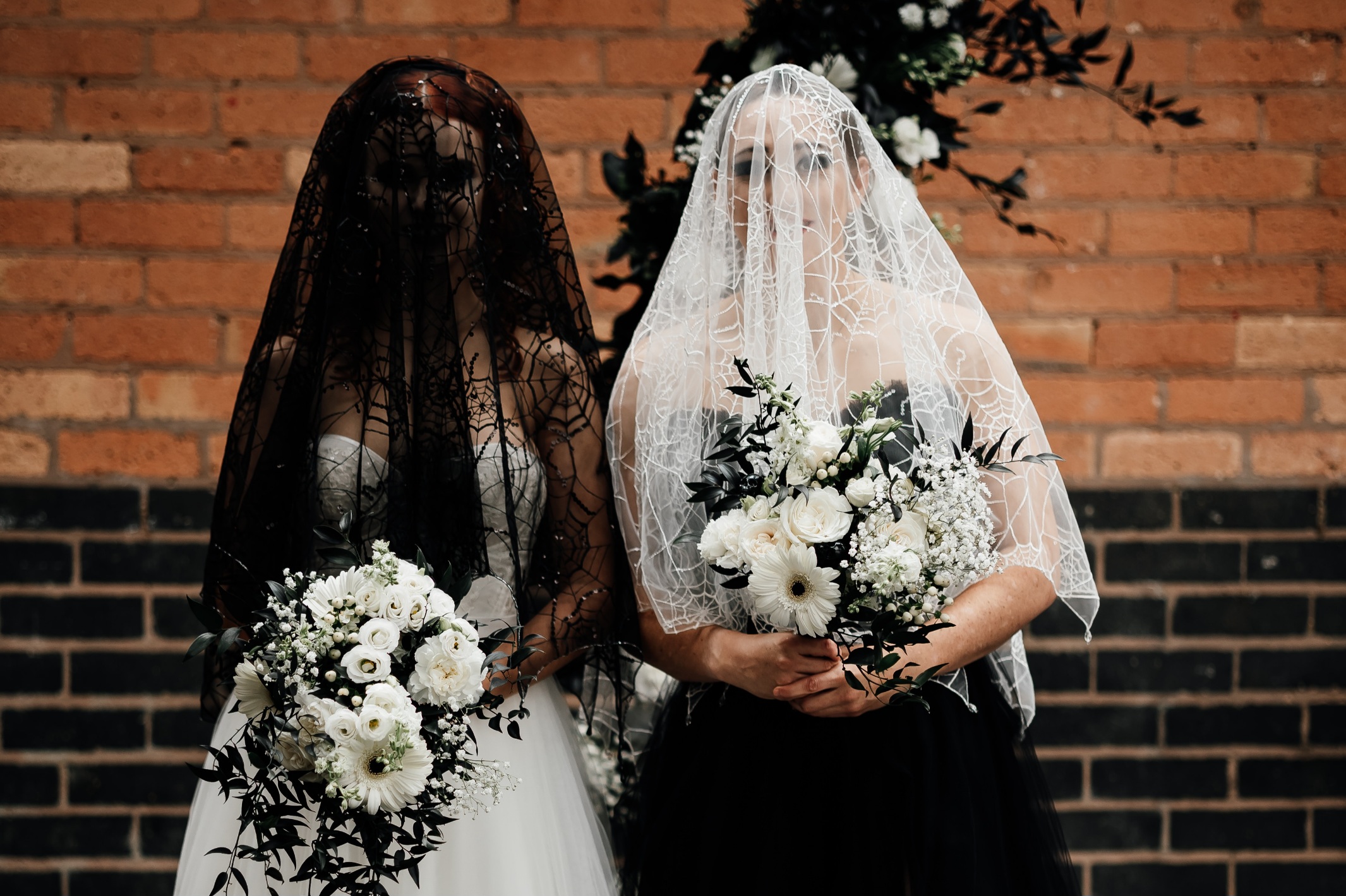 Alternative bride wears bespoke wedding dress and veil by holly winter couture