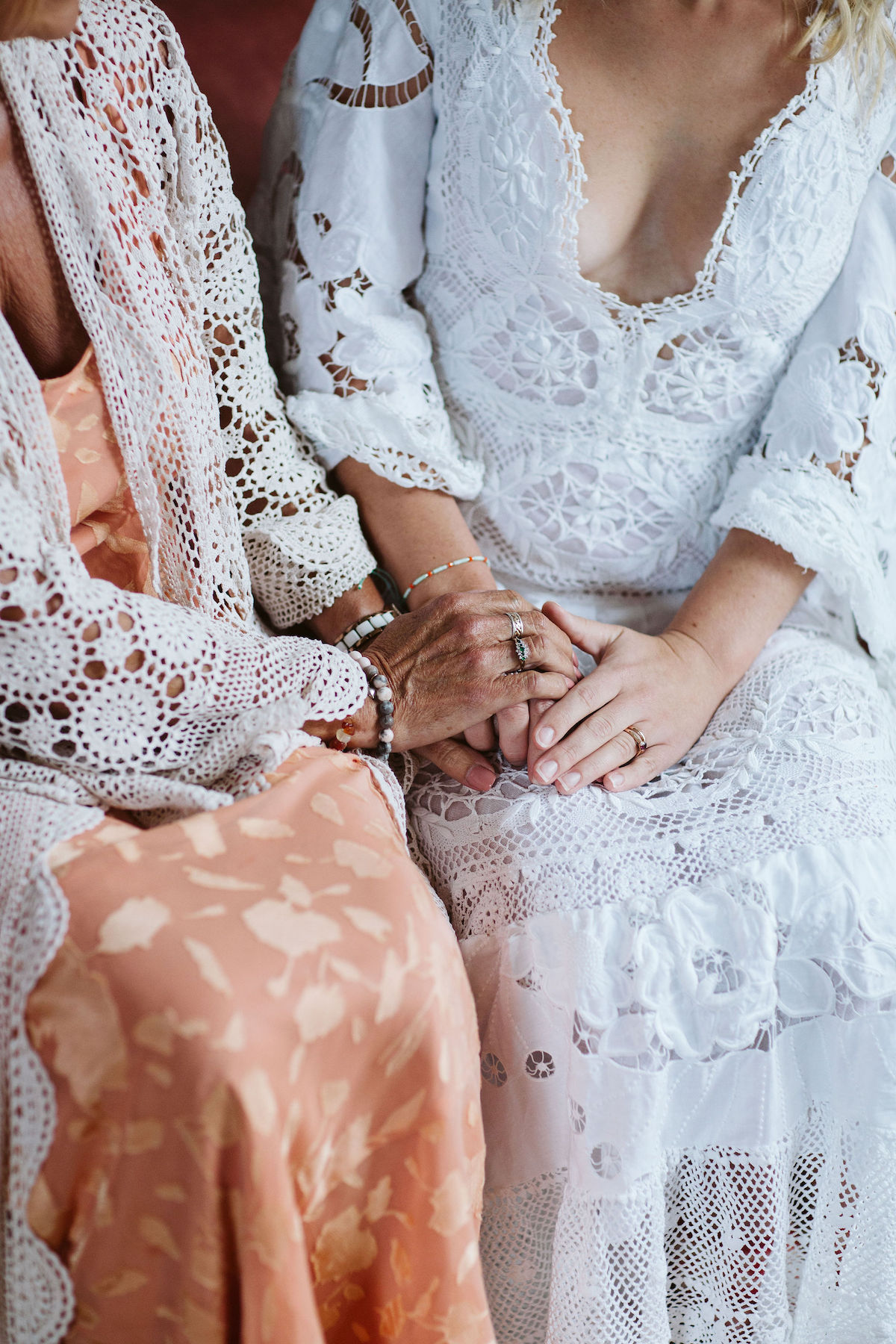 close up of mother holding daughters hands to show mother-daughter connection
