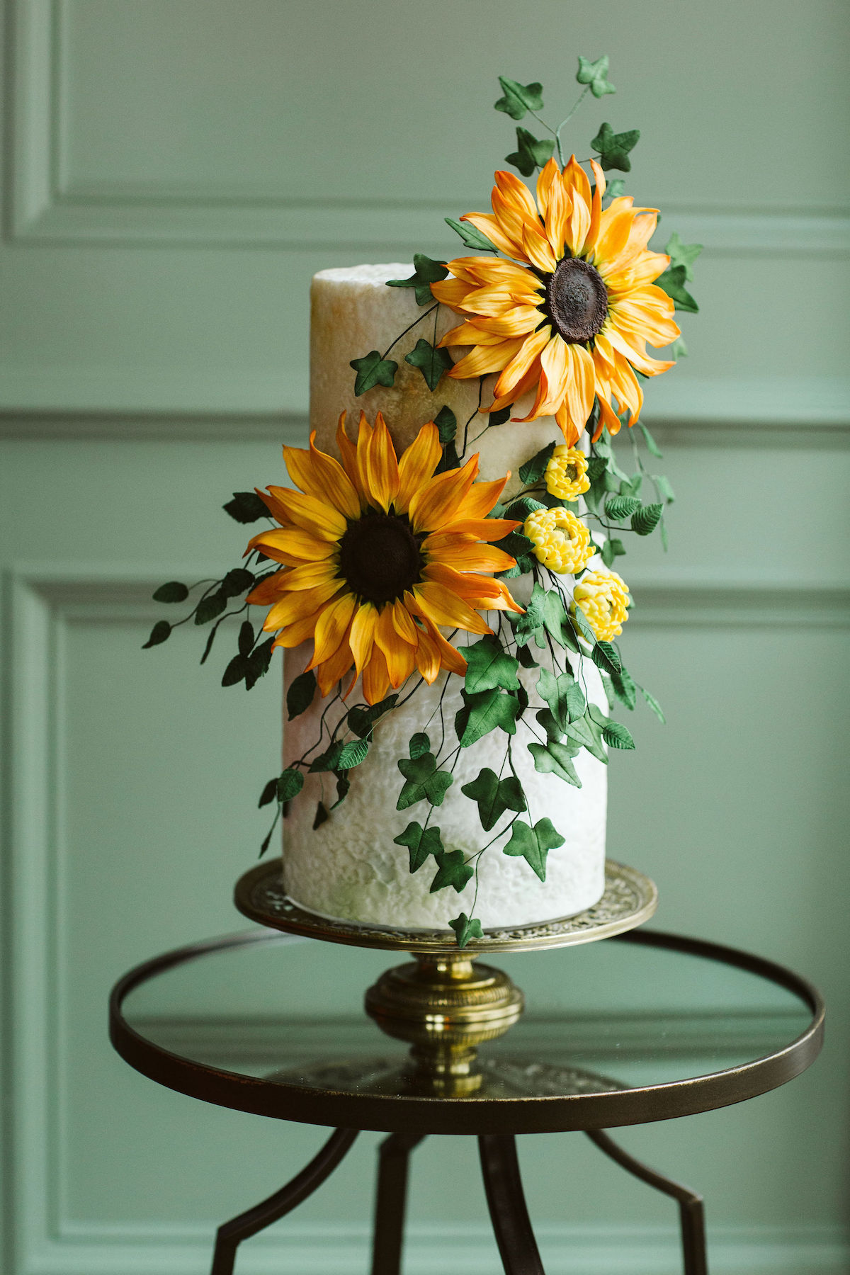 Gilmore Girls inspired wedding cake covered with sugar sunflowers and ivy