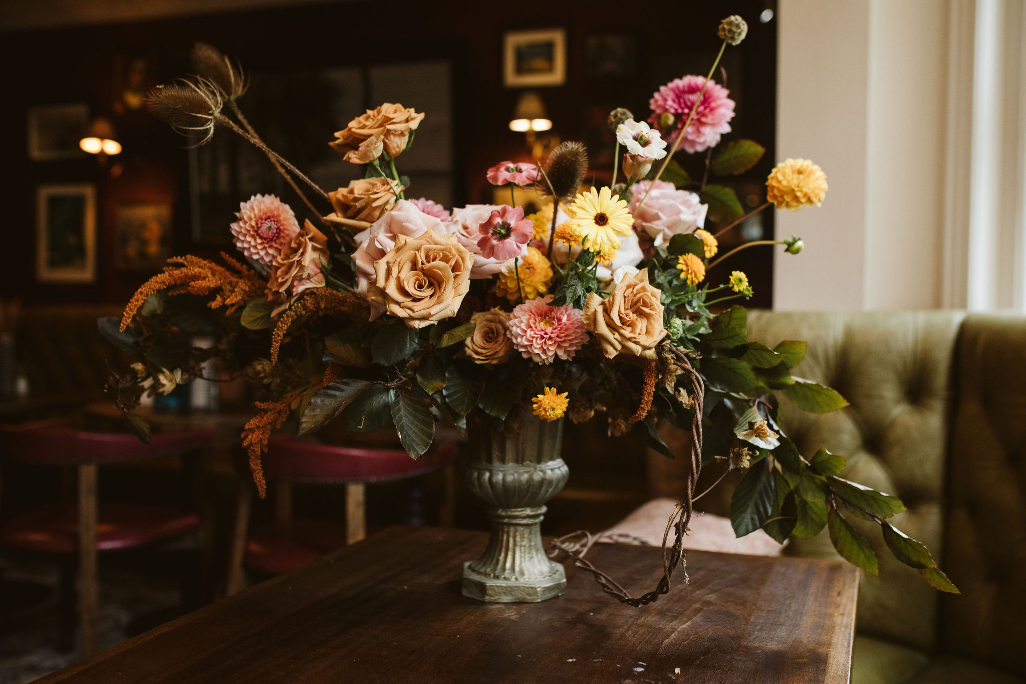 British grown flowers arranged in a vase in a cosy wedding venue for Autumn Wedding