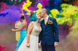 ipswich wedding fair at inspire by quirky weddings. Alternative bride and groom kiss in a smoke bomb photo