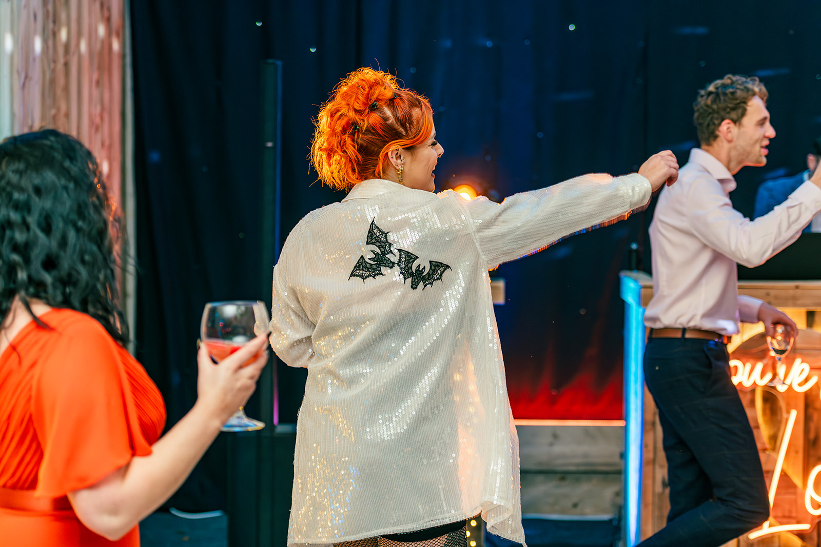 Bride's alternative second look - a sequin shirt with black bat motifs on the back