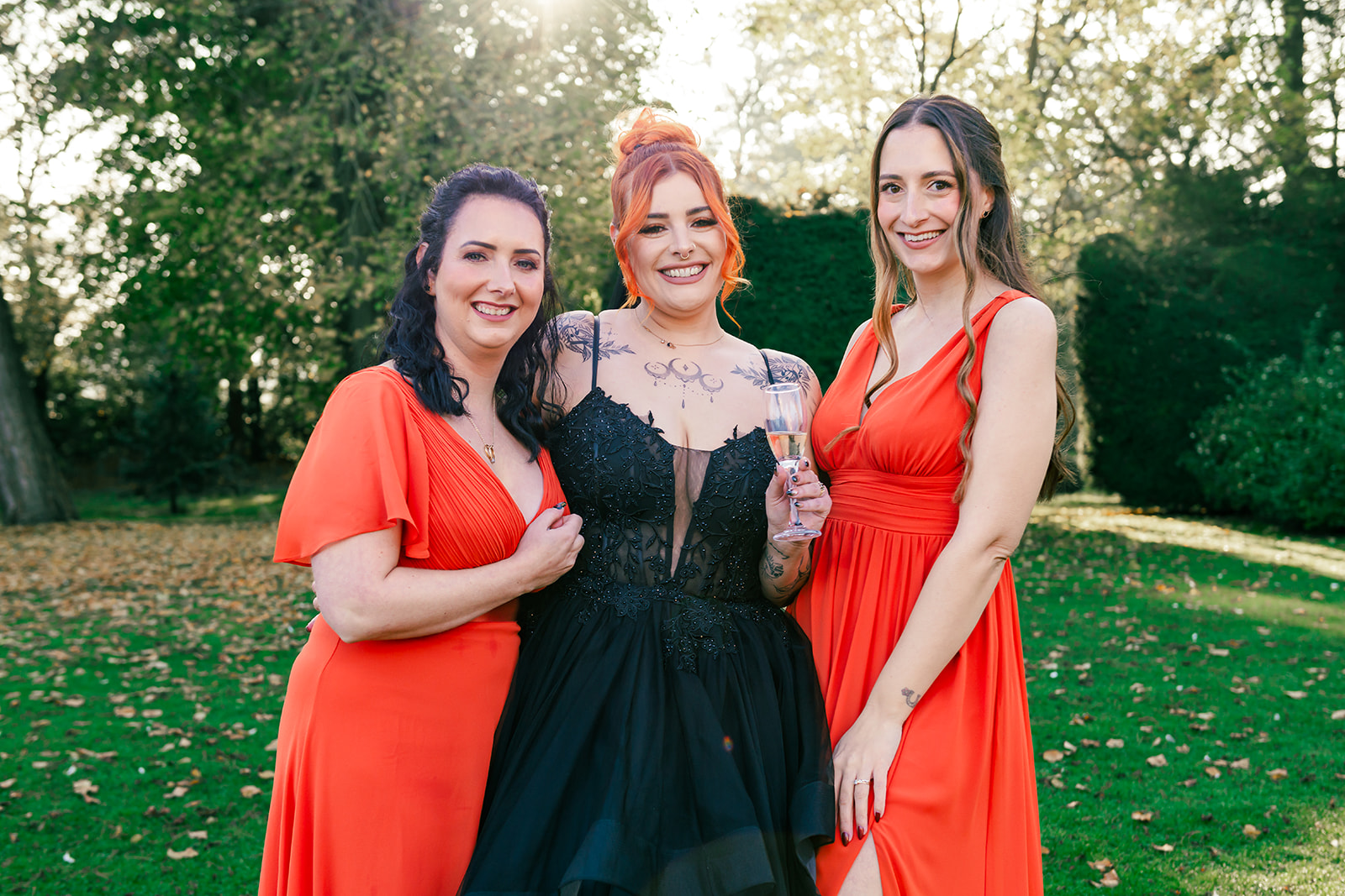 bride wearing black with her bridesmaids in orange for Pumpkin inspired Gothic Halloween wedding