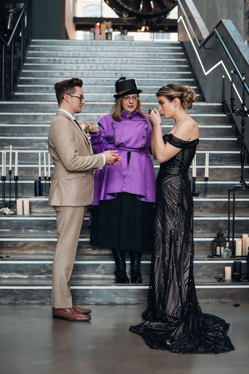 bride drinking from a cup as part of an Alice in Wonderland inspired wedding ceremony