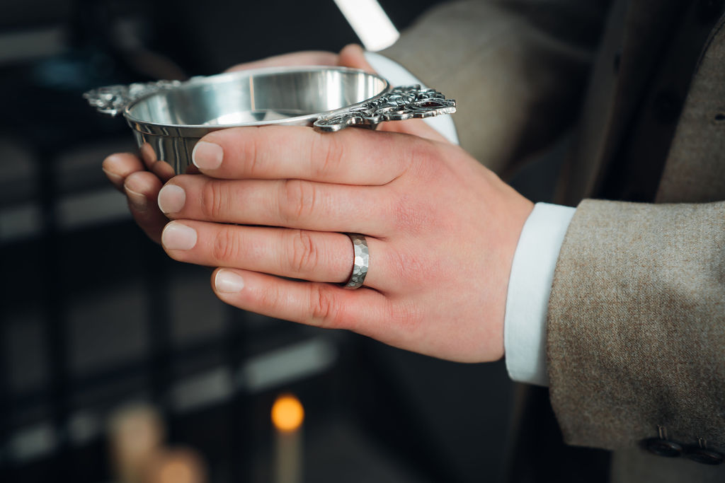 detail shot of the textured titanium wedding ring