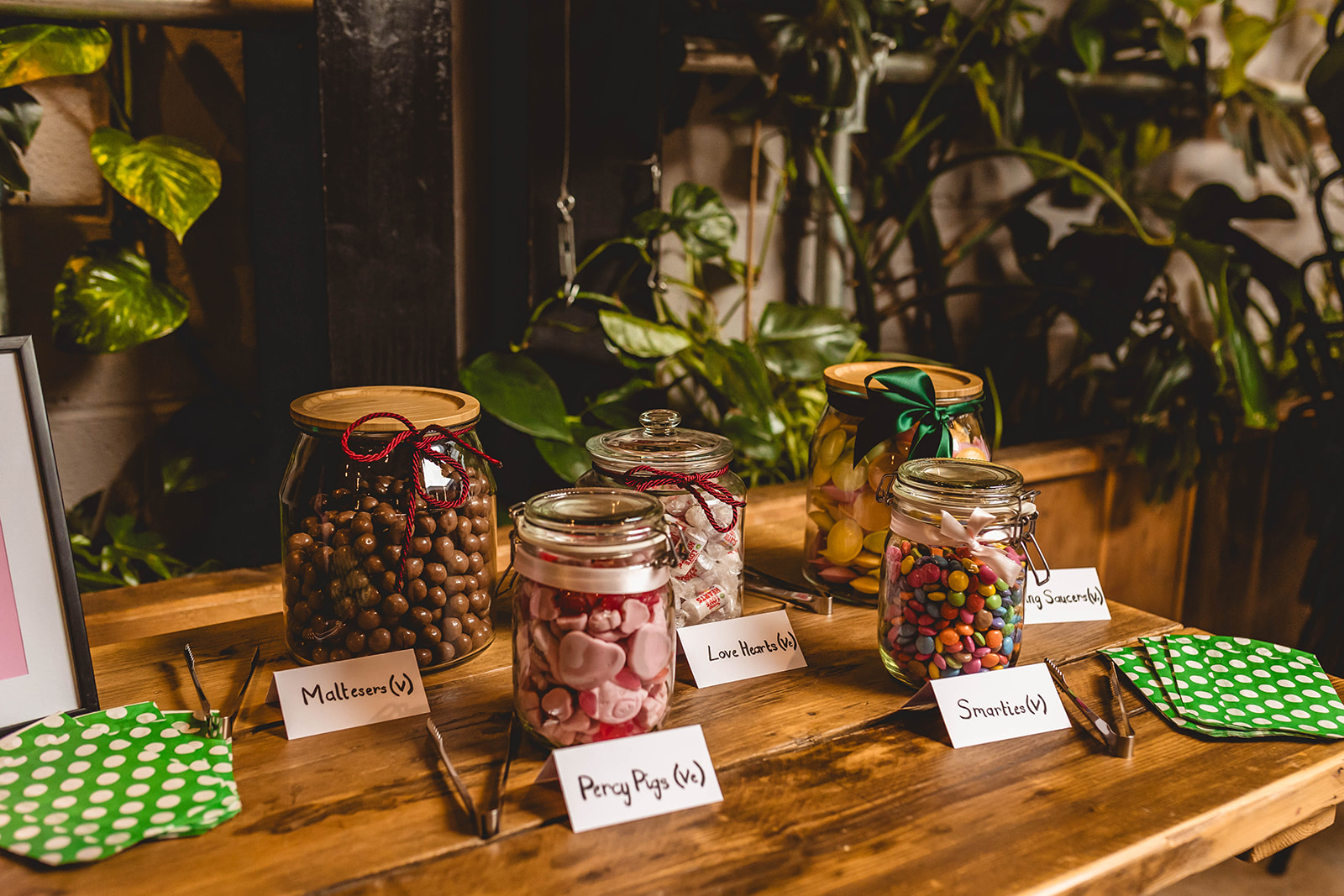 sweet jars on a table for wedding guests