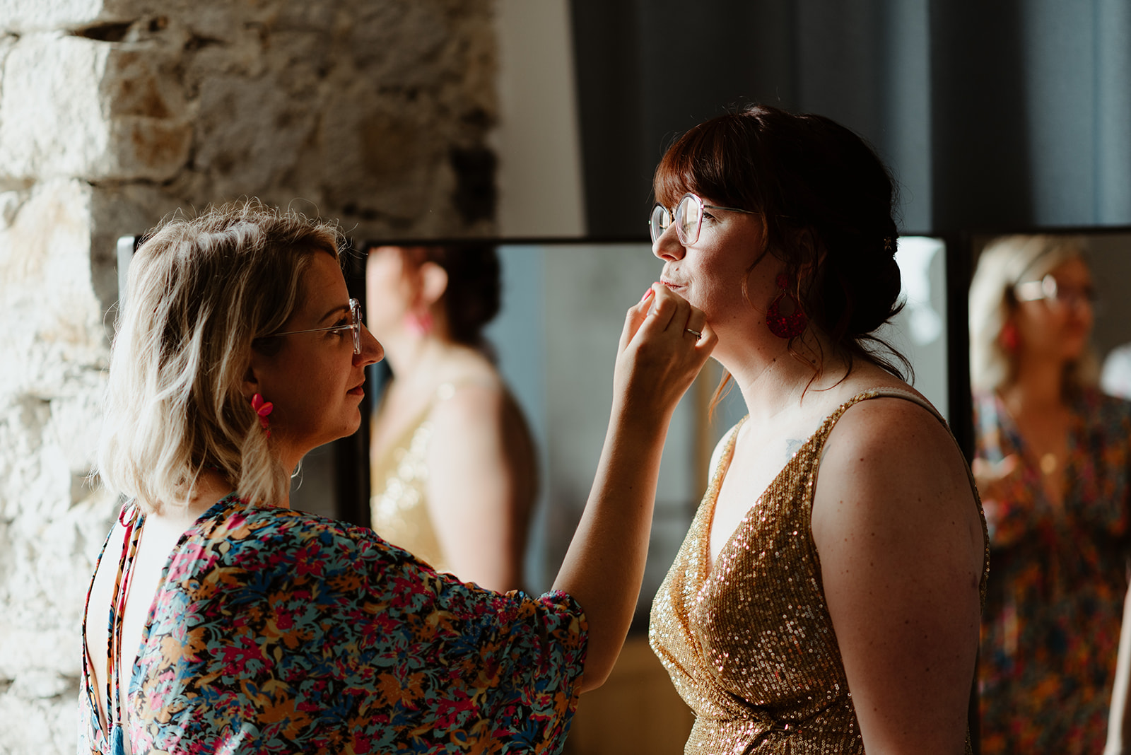 bride having her lipstick applied before her French wedding ceremony