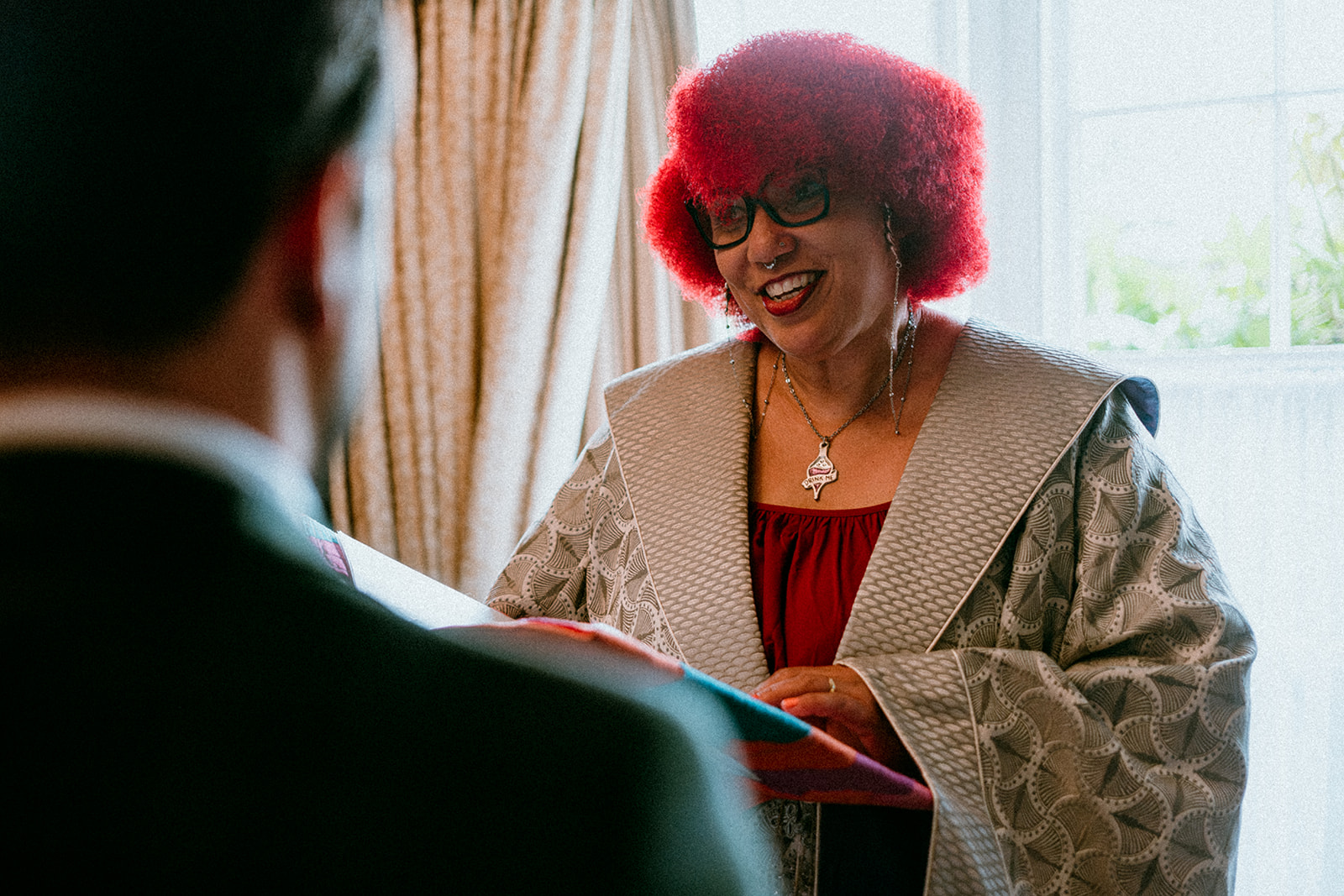 Portrait of red hair wedding celebrant delivering a personalised wedding ceremony inspired by the film Wicked