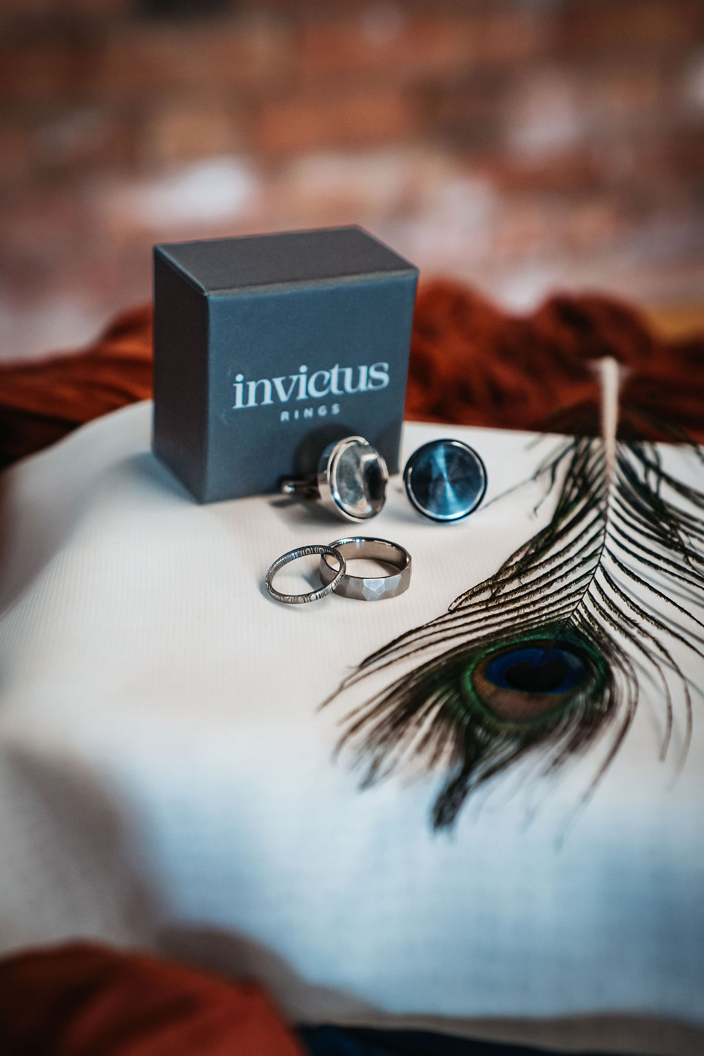 Detail shot of handmade hammered wedding rings and cufflinks for industrial wedding