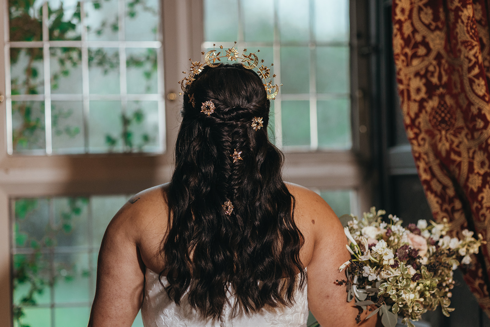 detail shot of a bridal half up hairstyle with celestial hairpins dotted through