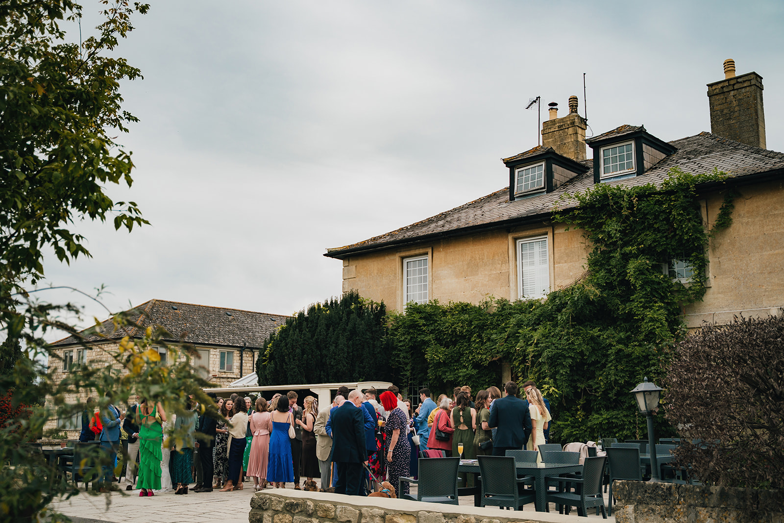 wedding guest outside of the relaxed wedding venue enjoying time celebrating with the couple