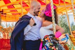 alternative couple get married at the fun fair. Image taken for the quirky wedding fayre
