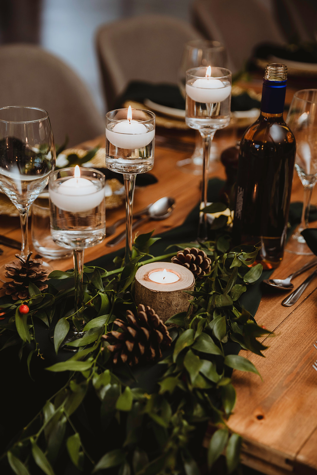 detail shot of the Viking banquet wedding breakfast table consisting of foliage, candles and pine cones