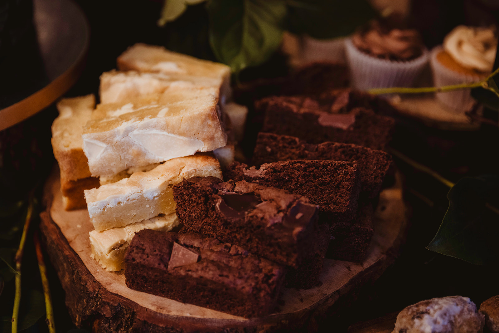 detail shot of some of the cakes from a sharing wedding breakfast desert table