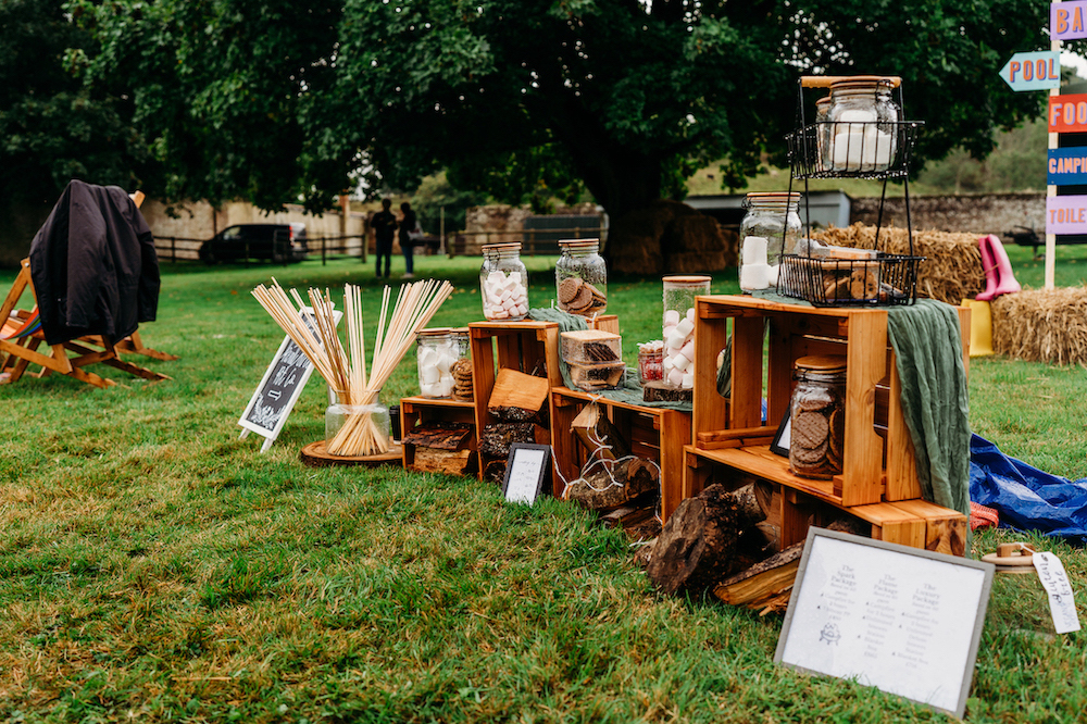 outdoor festival wedding fire pit smores set up