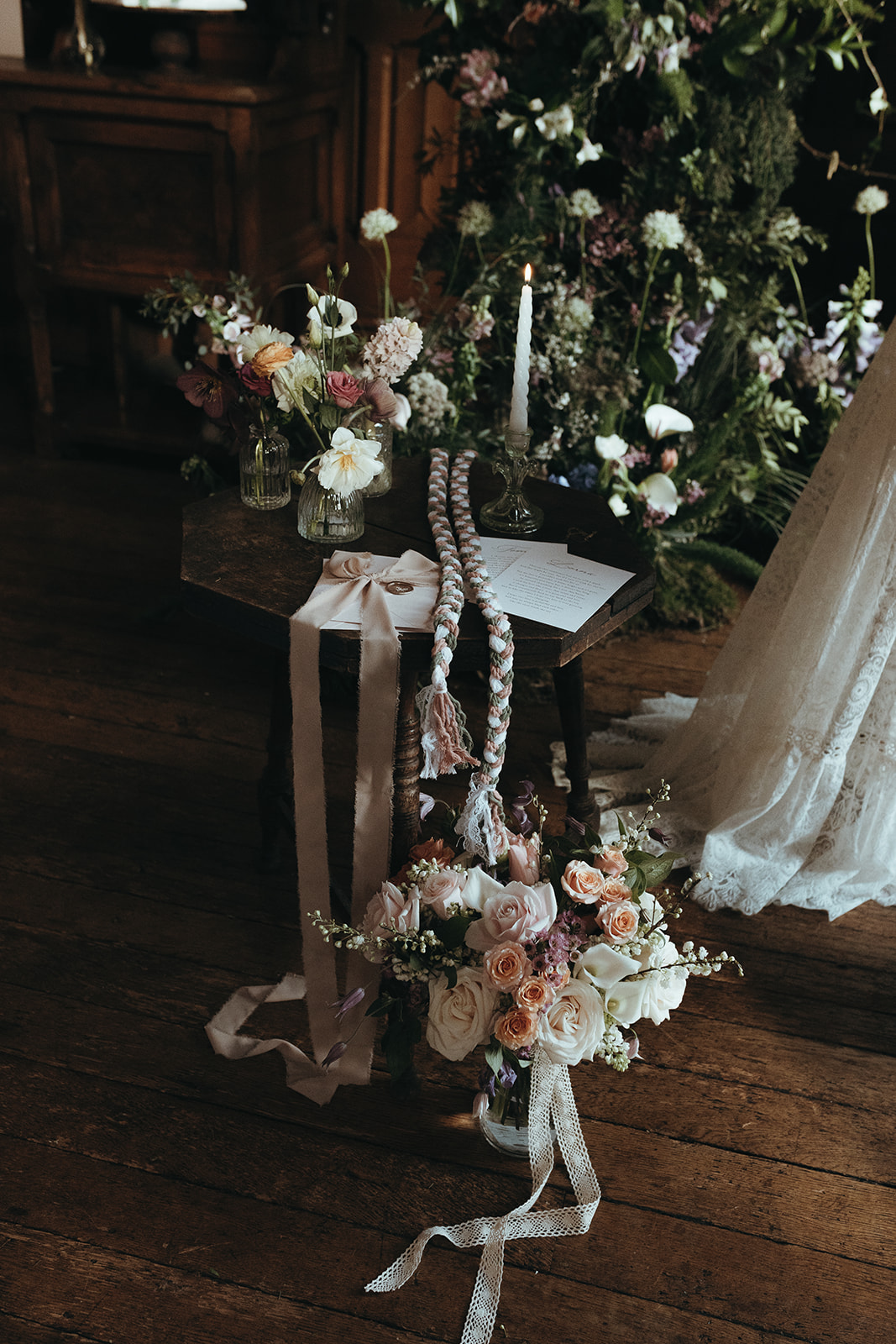 detail shot of the brides bouquet with a handmade handfasting cord