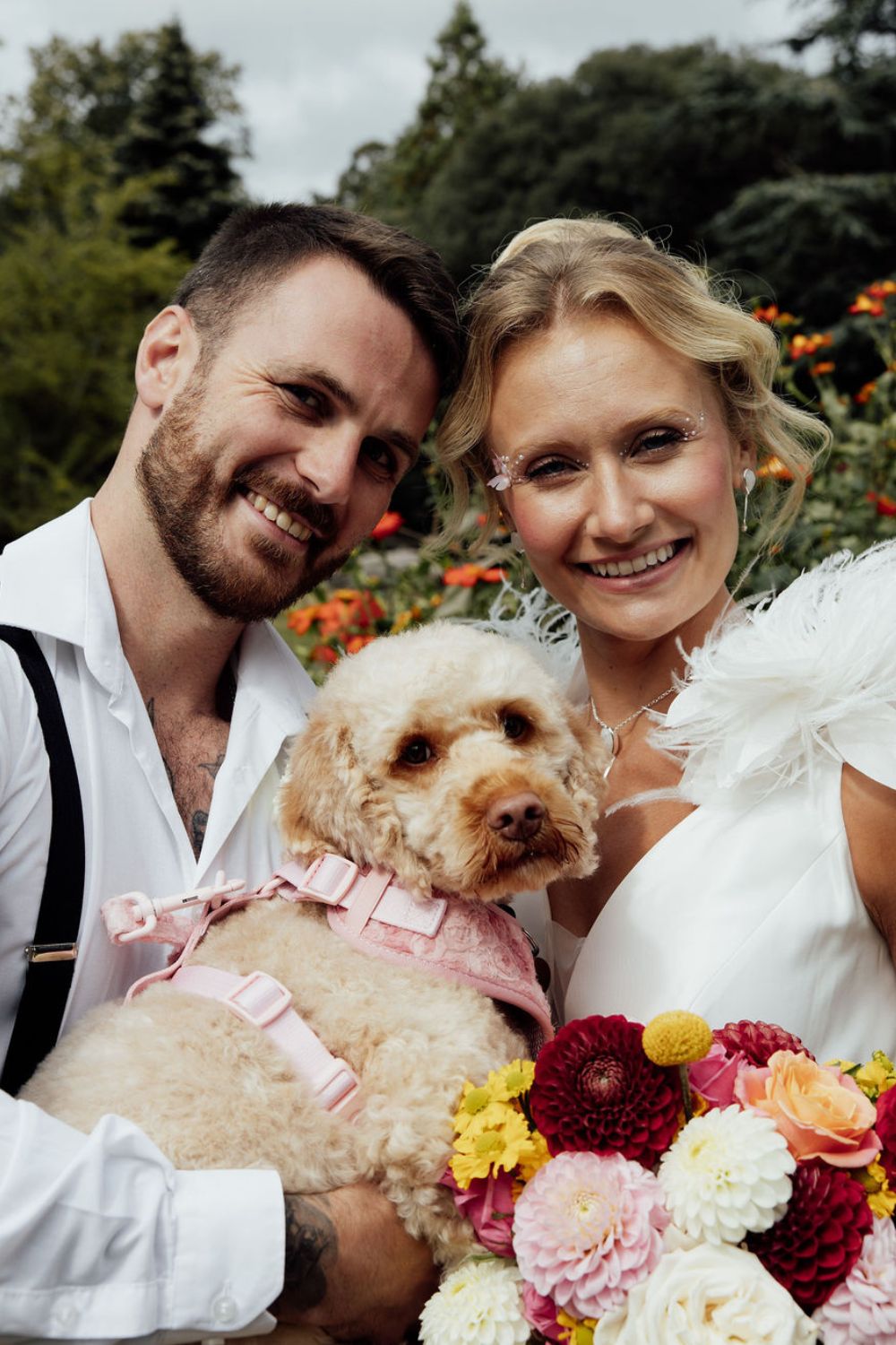 couple portrait with dog at carnival wedding