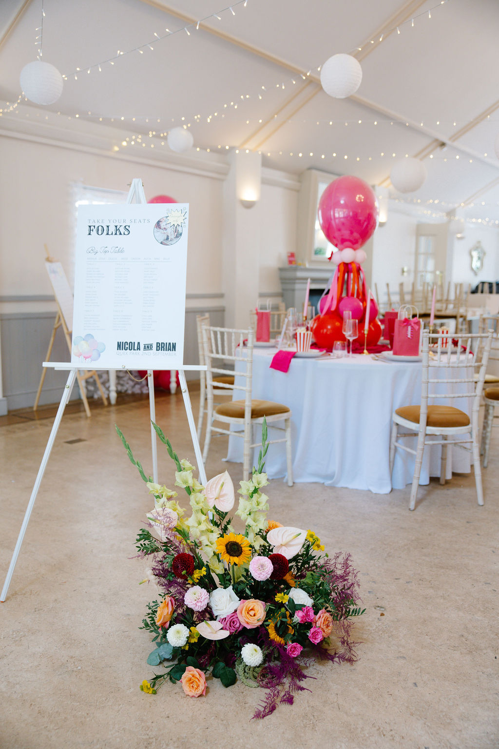 carnival seating plan with bright coloured floral floor display