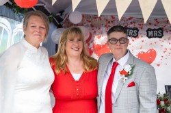 debbie munro wedding celebrants stands with her newlywed couple after the wedding ceremony