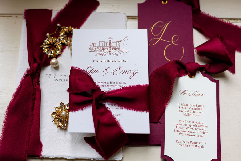 flat lay of stationery suit for Powderham Castle historical wedding