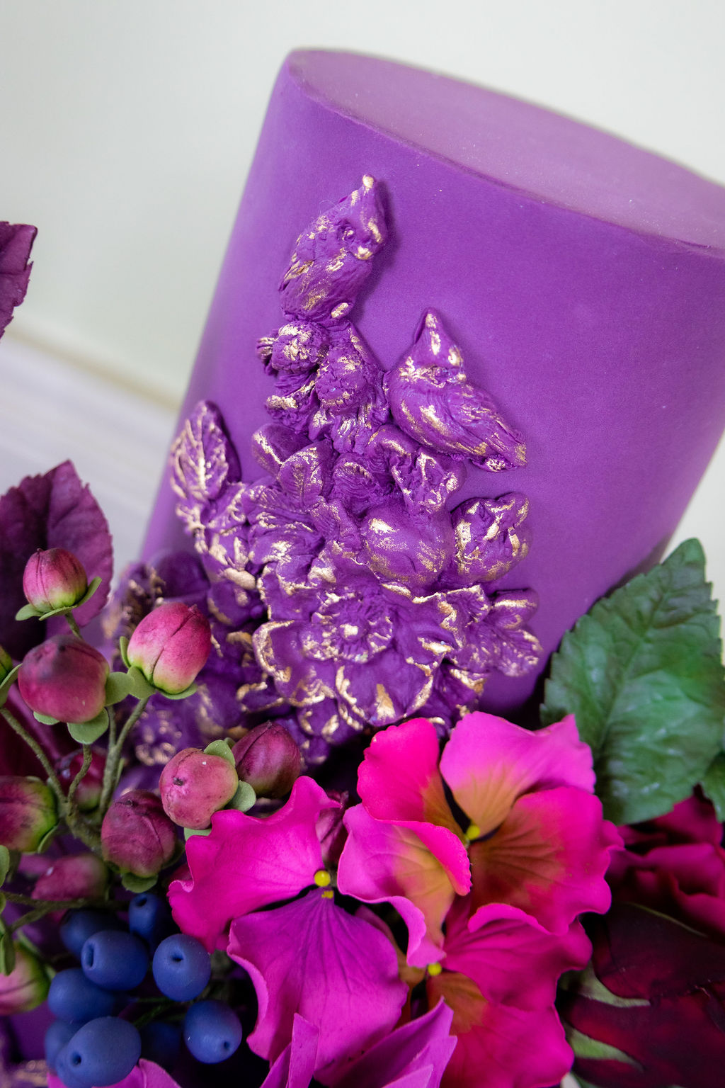 detail shot of the top tier of a purple wedding cake